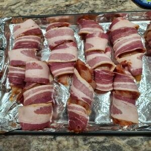 Raw bacon wrapped chicken