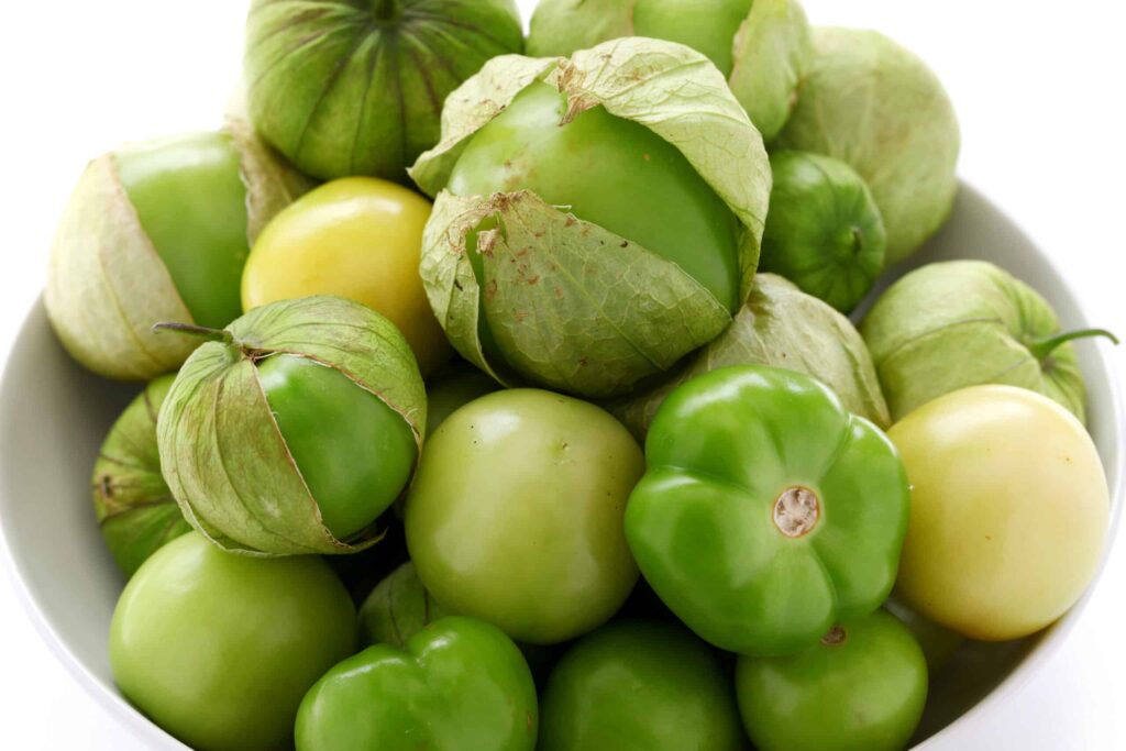 Tomatillos with husks prior to preparing